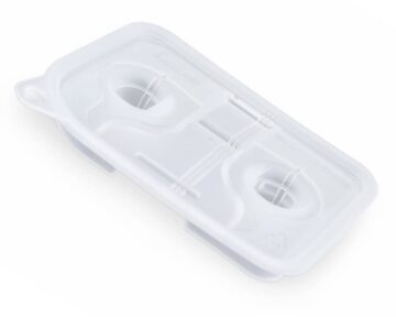 A white plastic tray with two holes on it, ideal for Fisher & Paykel Sleepstyle Chamber Seal Replacement.