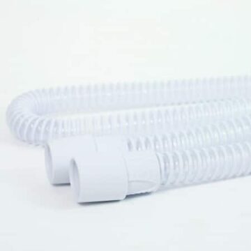 A pair of white Z2 & Z1 Travel CPAP Slimstyle Tubing hoses on a white surface.