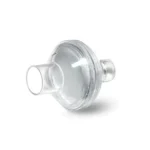 A clear plastic respiratory filter with two cylindrical connectors on either side, set against a white background.