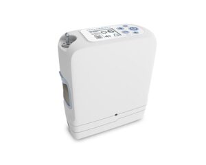 An Inogen One G5 Portable Oxygen Concentrator with 16 Cell Battery/Extended Life Battery device with a blue screen on it.