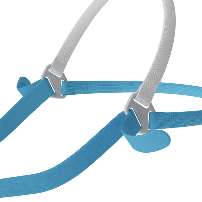 Close-up of blue and white adjustable straps with metal buckles on a neutral background, part of the Fisher & Paykel Nova Micro Nasal Pillow CPAP Mask (Fit Pack).