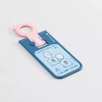 Blue and pink infant/child key for adjusting a car seat, with a paired illustration showing proper use for children under 55 lbs. HeartStart FRX Replacement Adult SMART Pads II (1 Pair) (Copy).