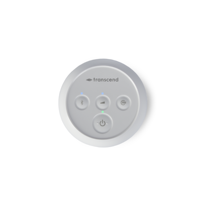 A round white object with buttons, resembling a sleek Transcend Micro Travel APAP Machine.