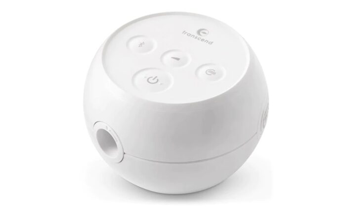 Spherical white device with "Transcend" branding, featuring four buttons on top, resembling a Transcend Micro Travel APAP Machine—likely a medical or electronic gadget.