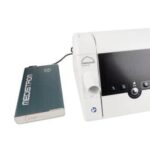 A Lowenstein prismaSMART CPAP/APAP Machine & prismaAQUA Humidifier with 19mm Standard Tubing connected to a battery pack.