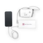 Three medical devices connected by cords, including a black rectangular unit, a white box with a power button, and another labeled "Zone Contact Mini," can easily rely on the Zopec Explore Mini Universal Battery Back Up.