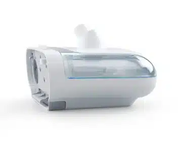 The Respironics DreamStation Heated Humidifier with Chamber, made of white and clear plastic, is shown on a plain white background.