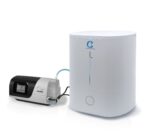 The CSpring MK3 Automatic CPAP Water Chamber Replenishing System connects to a white CPAP water chamber humidifier with a display screen and tubing.