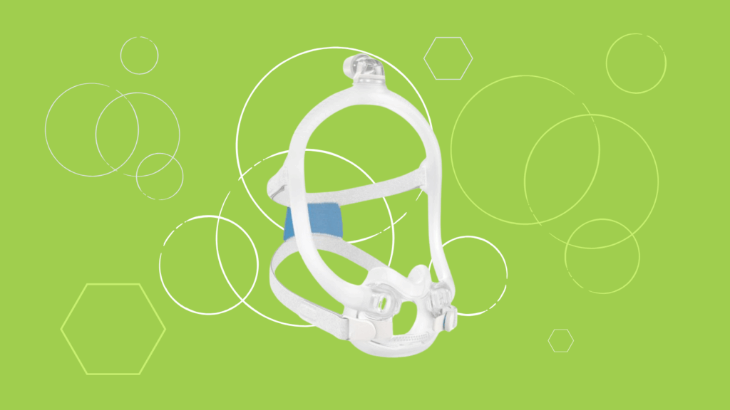 A ResMed AirFit F30i Full Face CPAP Mask with headgear is displayed on a light green background with white circles and hexagons.