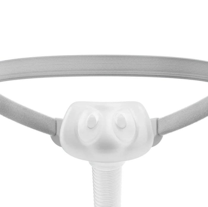 The Fisher & Paykel Solo Nasal Pillow CPAP Mask (Fit Pack) includes medical white headgear with a central nose piece and side straps, shown against a plain background.