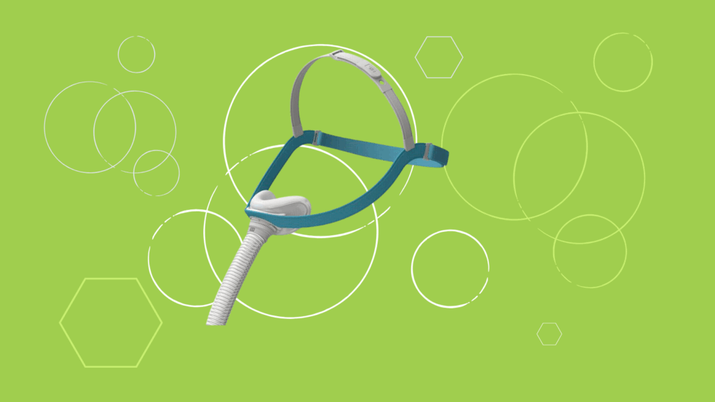 The Fisher & Paykel Evora Nasal CPAP Mask with headgear and tube is displayed on a green background with white geometric shapes. Perfect for your next CPAP Mask Review or sleep therapy setup!.