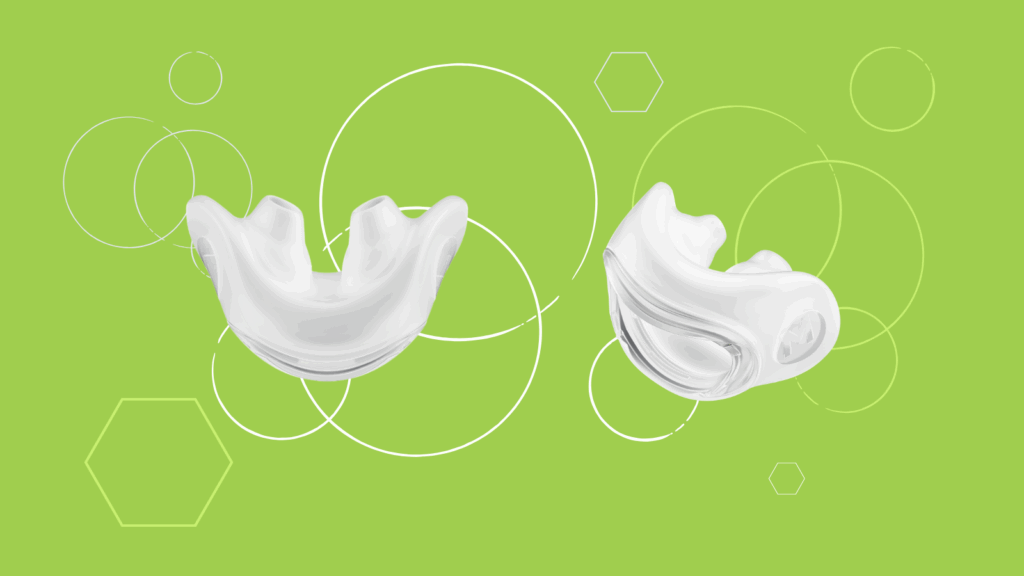 Two white dental mouthguards on a green background with geometric circle and hexagon patterns, perfect for a product review or comparison with popular brands like Fisher & Paykel.