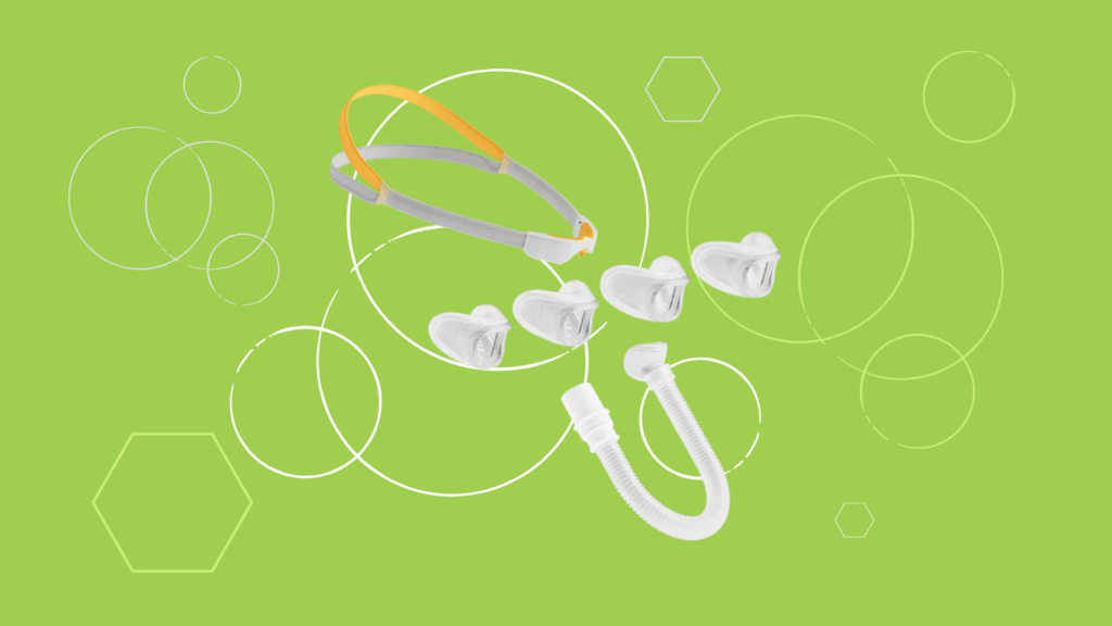 Sleep apnea and snoring devices, such as the Fisher & Paykel Solo Nasal Pillow Mask, a headband, nasal inserts, and a tube, are featured on a green background—perfect for your next product review.