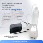 The Cspring Mini Portable CPAP Water Replenishment System sits beside a Mini Portable CPAP and water bottle, showcasing its travel-friendly design and automated water refill capability.