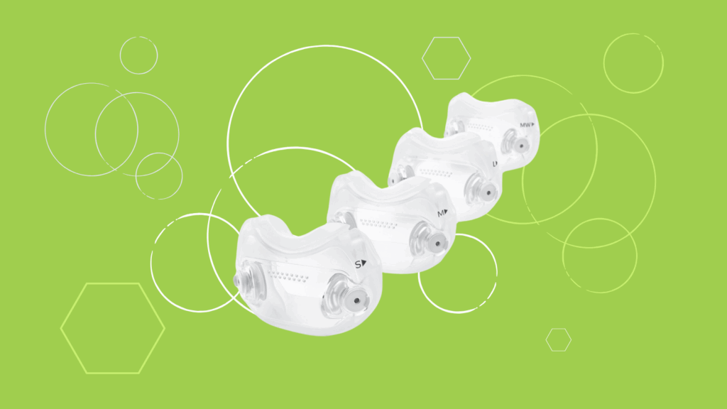 Four transparent dental mouthguards arranged diagonally on a green background with white geometric shapes, resembling the sleek design seen in a Dreamwear Full Face CPAP Mask.