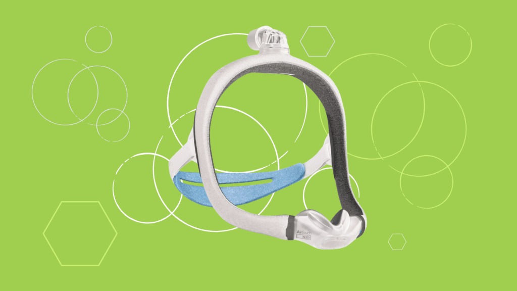 A ResMed AirTouch N30i nasal CPAP mask headgear with a soft blue and gray strap is displayed on a green background with white circles.