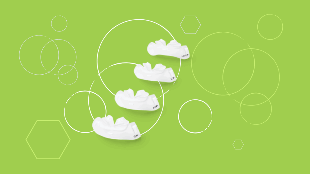 Four white dental aligners, reminiscent of Dreamwear Silicone Nasal Pillow design, are arranged diagonally on a green background accented with circles and hexagons.