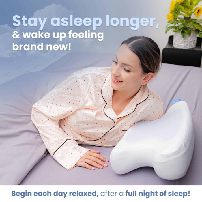 Woman in pajamas smiles in bed with a Kego Contour CoolPAP Travel Pillow, promoting restful sleep and relaxation.