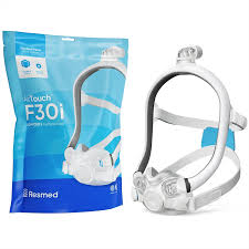 A ResMed AirTouch F30i Comfort Full Face CPAP Mask is displayed beside its blue and white packaging.