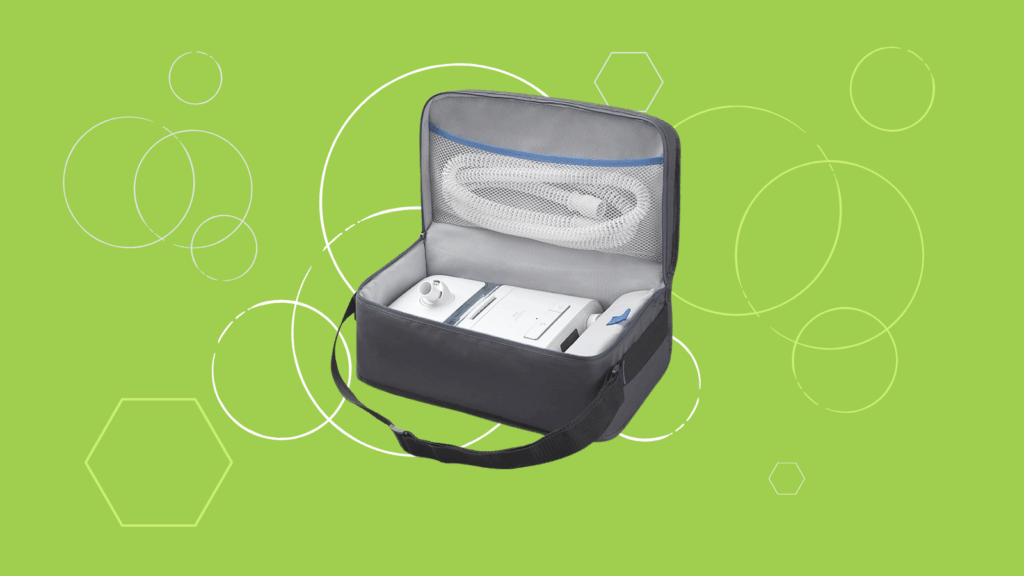 A black carrying case with a Philips Respironics DreamStation BiPAP Pro device and tubing inside, on a green background with geometric shapes.