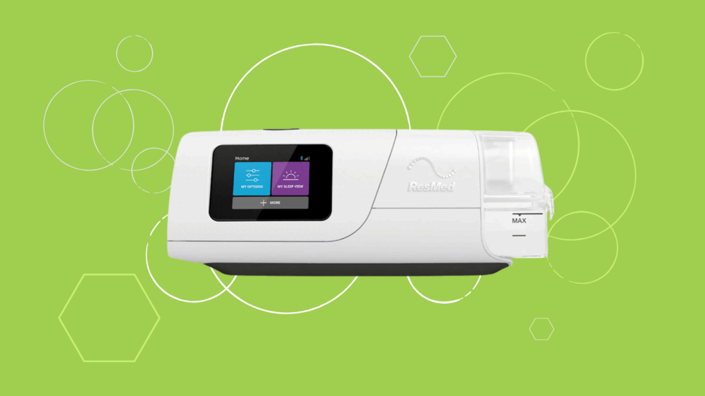 A ResMed AirCurve 11 sleep apnea machine with a digital screen is showcased on a green background with hexagon patterns, perfect for anyone seeking a VAuto BiPAP solution.