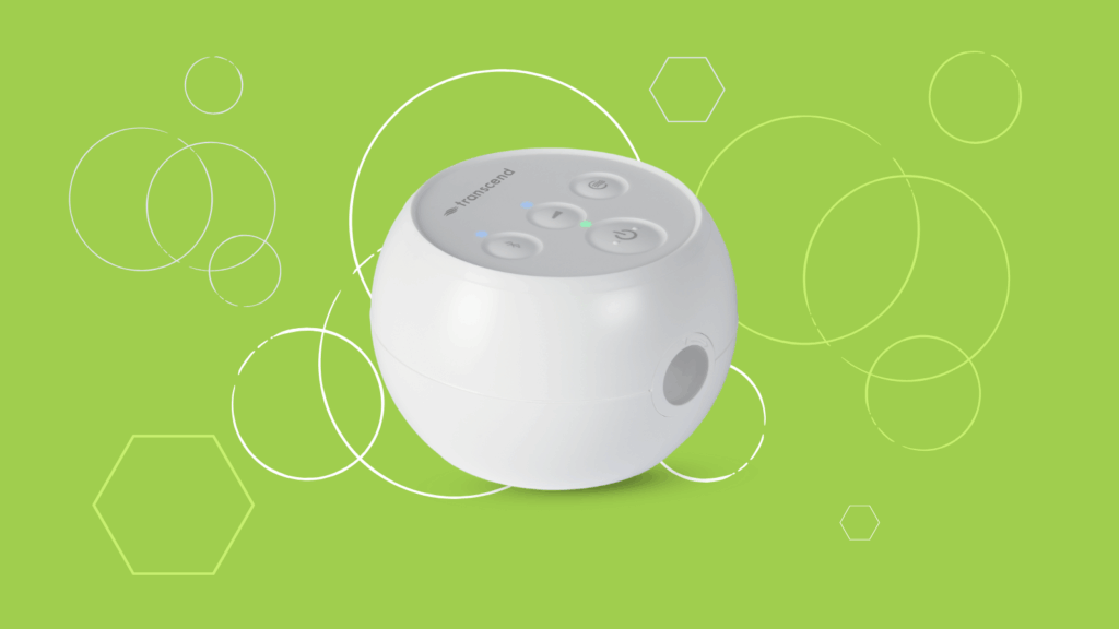 White, round electronic device with buttons, on a green background with circles and hexagons.