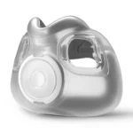 The ResMed AirFit F30i Comfort Full Face CPAP Mask Cushion is a transparent silicone replacement with a round valve and two rectangular openings.