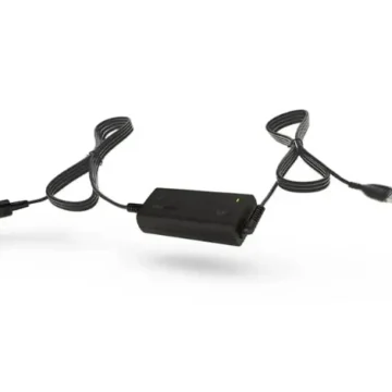 The ResMed Airsense DC-DC Converter for ResMed Machines is a black power adapter with a car charger plug and laptop connector, compatible with ResMed Airsense devices, shown against a white background.