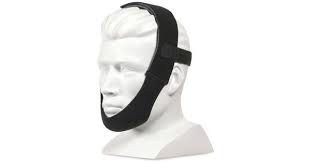 A white mannequin head models the Respironics Premium Chin Strap in black, designed to reduce snoring and provide sleep support.